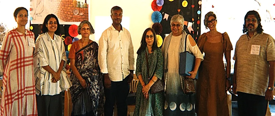 Panellists and guests at Clay4Change 2026, standing together in front of the event banner